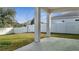 Covered patio with concrete flooring and access to backyard at 14789 Milfoil Ave, Orlando, FL 32827