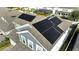 Aerial view of house rooftop with solar panels installed for energy efficiency and modern living at 14789 Milfoil Ave, Orlando, FL 32827