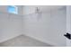 Walk-in closet with a wire shelf and neutral carpet and walls at 14789 Milfoil Ave, Orlando, FL 32827
