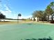 Full-size outdoor basketball court with scenic lake views at 1604 Scarlet Oak Loop # B, Winter Garden, FL 34787