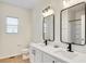 Bathroom featuring double sinks, modern fixtures, and vanity at 1604 Scarlet Oak Loop # B, Winter Garden, FL 34787