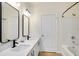 Bright bathroom featuring double sinks, modern fixtures, and shower over tub at 1604 Scarlet Oak Loop # B, Winter Garden, FL 34787