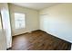 Bright bedroom with wood-look floors and double door closet at 1604 Scarlet Oak Loop # B, Winter Garden, FL 34787