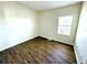 Simple bedroom with wood-look floors and a window at 1604 Scarlet Oak Loop # B, Winter Garden, FL 34787