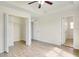 Large primary bedroom with wood-look floors and walk-in closet at 1604 Scarlet Oak Loop # B, Winter Garden, FL 34787