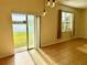 Dining area with lake view and sliding glass doors at 1604 Scarlet Oak Loop # B, Winter Garden, FL 34787