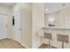 Hallway with breakfast bar featuring tile flooring, bar stool seating and natural light at 1604 Scarlet Oak Loop # B, Winter Garden, FL 34787