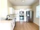 Modern kitchen with white cabinets and black faucet at 1604 Scarlet Oak Loop # B, Winter Garden, FL 34787