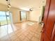 Open living room with tile floors and lake view at 1604 Scarlet Oak Loop # B, Winter Garden, FL 34787