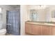 Clean bathroom, shower stall and wood vanity at 212 Rialto Rd, Kissimmee, FL 34759