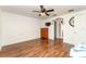 Well-lit bedroom with wood flooring and ceiling fan at 212 Rialto Rd, Kissimmee, FL 34759