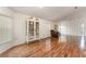 Living room with hardwood floors, large windows, and a comfy recliner at 212 Rialto Rd, Kissimmee, FL 34759