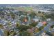 Aerial view of the home showcasing the roof, landscaping, pool, and surrounding neighborhood at 2235 Ginger Way, Lakeland, FL 33801