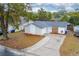 Charming single-story home featuring a stone accent wall, driveway, and well-maintained front yard at 2235 Ginger Way, Lakeland, FL 33801