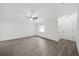 Bright living room with modern flooring, neutral paint, and a view of the front entrance at 2235 Ginger Way, Lakeland, FL 33801