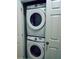 Stackable Samsung washer and dryer in a closet at 2545 Old Kent Cir, Kissimmee, FL 34758