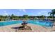 Inviting pool with fountain and plenty of lounge chairs at 2545 Old Kent Cir, Kissimmee, FL 34758