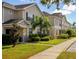 Row of townhouses with tan siding and landscaping at 2545 Old Kent Cir, Kissimmee, FL 34758