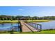 Wooden dock extending over calm lake waters at 2545 Old Kent Cir, Kissimmee, FL 34758