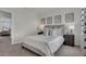 Bedroom with a gray bed, dark brown nightstand, and window view at 2916 Moulin Rd, Davenport, FL 33837