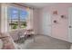 bedroom with pink walls, a small table and chairs, and a window seat at 2916 Moulin Rd, Davenport, FL 33837