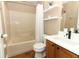 Clean bathroom with a tub, shower, and updated vanity at 30129 Pga Dr, Sorrento, FL 32776