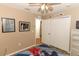 Second bedroom with double doors to a closet and wood-look floors at 30129 Pga Dr, Sorrento, FL 32776