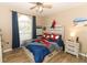 Cozy bedroom with a Spiderman-themed bed and built-in storage at 30129 Pga Dr, Sorrento, FL 32776