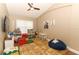 Playroom with hardwood floors, plenty of toys and a beanbag chair at 30129 Pga Dr, Sorrento, FL 32776