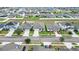 Aerial view of several homes with solar panels in a residential area at 309 Citrus Isle Loop, Davenport, FL 33837