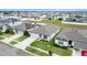 Aerial view of a two-story house with solar panels and a small yard at 309 Citrus Isle Loop, Davenport, FL 33837