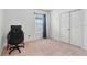 Bedroom with a desk and double doors at 309 Citrus Isle Loop, Davenport, FL 33837