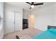 Bedroom with double doors and TV stand at 309 Citrus Isle Loop, Davenport, FL 33837