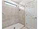 Clean shower with neutral tile and a window for light at 309 Citrus Isle Loop, Davenport, FL 33837