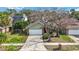 House exterior view showing driveway and landscaping at 3131 Ash Park Loop, Winter Park, FL 32792