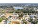 Aerial view of a house in a residential neighborhood near a lake at 3131 Ash Park Loop, Winter Park, FL 32792