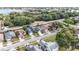 Aerial view of a residential neighborhood with a house near a lake at 3131 Ash Park Loop, Winter Park, FL 32792