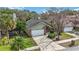 Aerial view of a house and surrounding neighborhood at 3131 Ash Park Loop, Winter Park, FL 32792