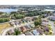 Aerial view of a residential area, showing a house near a lake at 3131 Ash Park Loop, Winter Park, FL 32792