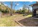 Backyard with grassy area, brick wall, and picnic table at 3131 Ash Park Loop, Winter Park, FL 32792