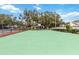 Community green basketball court with tennis courts nearby at 3131 Ash Park Loop, Winter Park, FL 32792