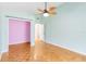 Bedroom with light walls, ceiling fan, and parquet flooring at 3131 Ash Park Loop, Winter Park, FL 32792