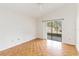 Spacious bedroom with wood flooring and sliding glass doors to patio at 3131 Ash Park Loop, Winter Park, FL 32792