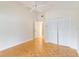 Bedroom with double door closet and wood flooring at 3131 Ash Park Loop, Winter Park, FL 32792