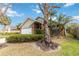 Brick ranch home with two-car garage and mature landscaping at 3131 Ash Park Loop, Winter Park, FL 32792