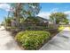 Landscaped corner lot with brick wall and lush greenery at 3131 Ash Park Loop, Winter Park, FL 32792