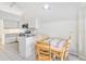 Kitchen with breakfast nook and view into dining area at 3131 Ash Park Loop, Winter Park, FL 32792