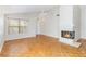 Living room with hardwood floors and a fireplace at 3131 Ash Park Loop, Winter Park, FL 32792