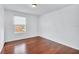 Bright bedroom featuring wood flooring and a window at 3235 Abiaka Dr, Kissimmee, FL 34743