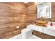 Modern bathroom with wood-like tile and copper sink at 3645 Mirror Lake Dr, Apopka, FL 32703